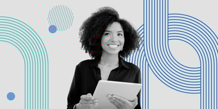 Smiling professional holding a tablet, representing modern association staff evaluating their association management software.
