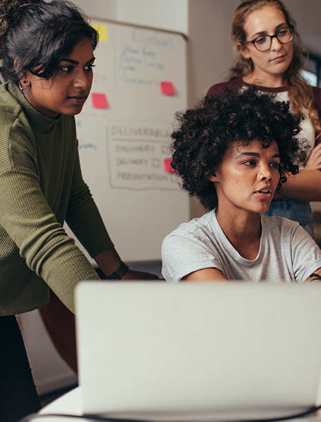 Support team working in an office on a computer