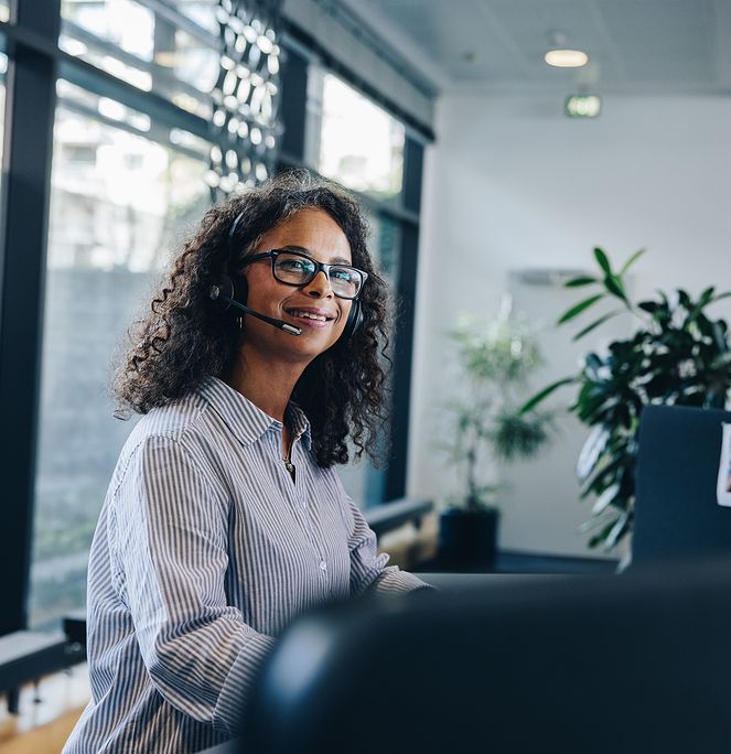 woman with a headset smiling