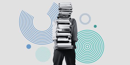 Person holding a stack of books