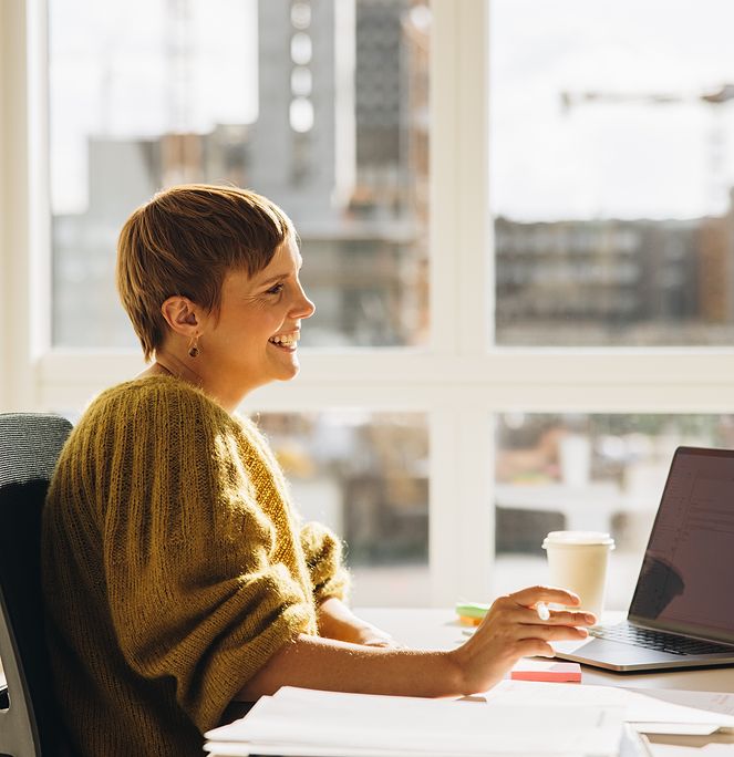 Woman smiling at desk