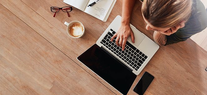 top aerial view of a woman using her laptop