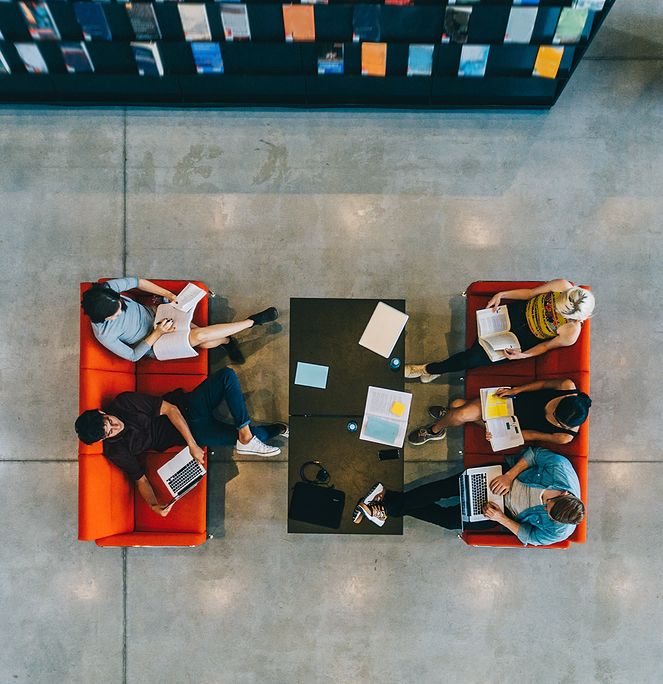 top aerial view of students studying in a library