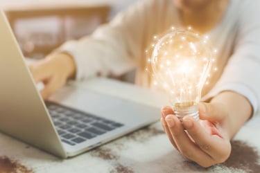 Lightbulb next to computer