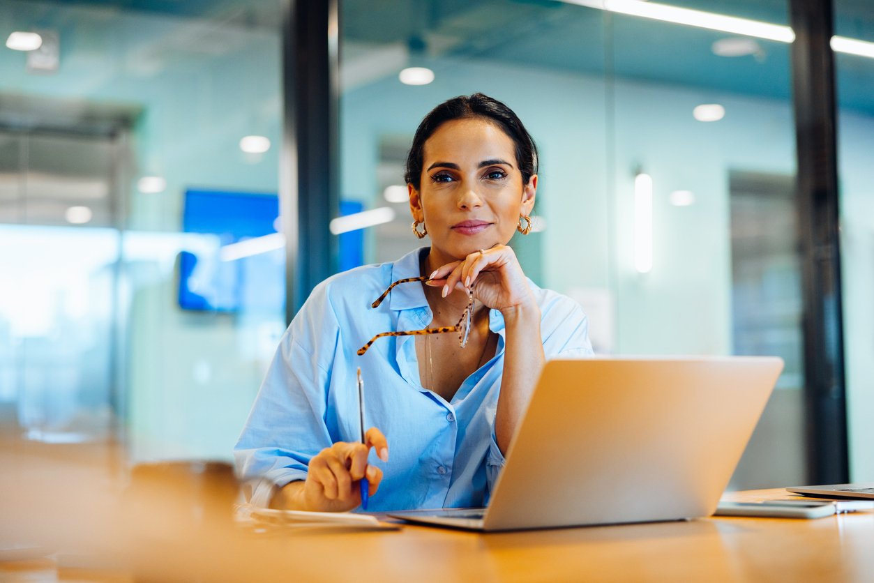 Association Executive at Desk on Laptop