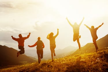 Group of people run and jump
