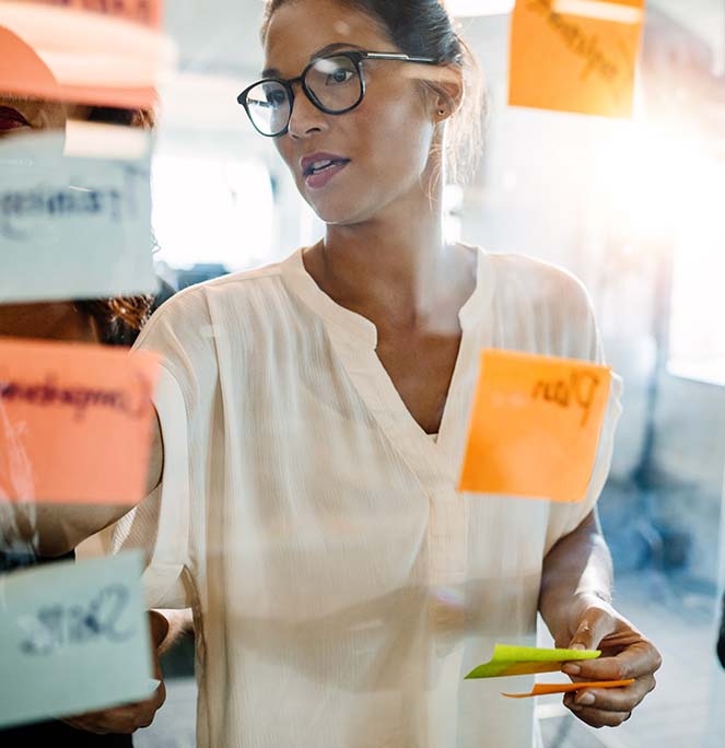 Woman using sticky notes